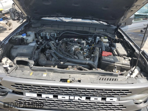 2023 Ford Bronco z VIN 1FMEE5DP0PLA94154, wystawiony jako Copart lot #62035445 z przebiegiem 47 559 mil mil oraz Szkoda całkowita • Salvage title. Historia ofert i sprzedaży dostępna na DreamBid. Obrazek 11.