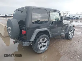 2004 Jeep Wrangler X with VIN 1J4FA39S34P753865, listed as a IAAI auction lot 41948545 with 198,169 mi miles. Bid and sale history available at carsss.com. Image 4.