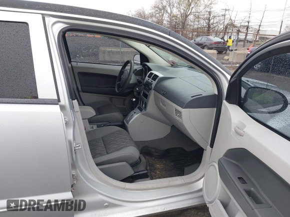 2007 Dodge Caliber SXT with VIN 1B3HB48BX7D379555, listed as a IAAI auction lot 42022554 with 99,670 mi miles and . Bid and sale history available at DreamBid. Image 5.