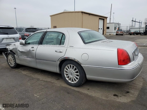 2003 Lincoln Town Car Signature with VIN 1LNHM82W63Y634731, listed as a Copart auction lot 44557045 with 145,541 mi miles and Salvage Title. Bid and sale history available at carsss.com. Image 2.
