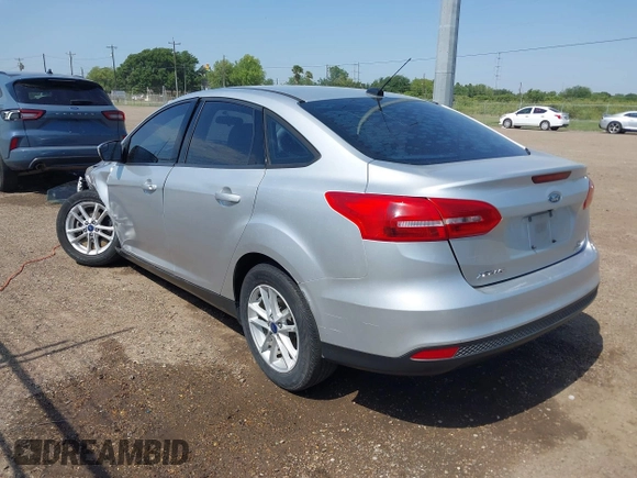 2018 Ford Focus SE z VIN 1FADP3FE0JL321530, wystawiony jako IAAI lot #42275532 z przebiegiem 65 412 mil mil oraz . Historia ofert i sprzedaży dostępna na DreamBid. Obrazek 3.