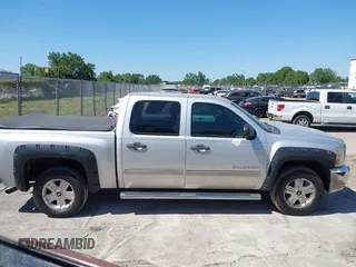 2013 Chevrolet Silverado 1500 LT with VIN 3GCPKSE71DG203443, listed as a IAAI auction lot 42033447 with 128,904 mi miles. Bid and sale history available at carsss.com. Image 13.