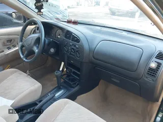 2000 Mitsubishi Mirage DE z VIN JA3AY26C2YU026564, wystawiony jako IAAI lot #42139336 z przebiegiem 53 947 mil mil oraz . Historia ofert i sprzedaży dostępna na DreamBid. Obrazek 5.