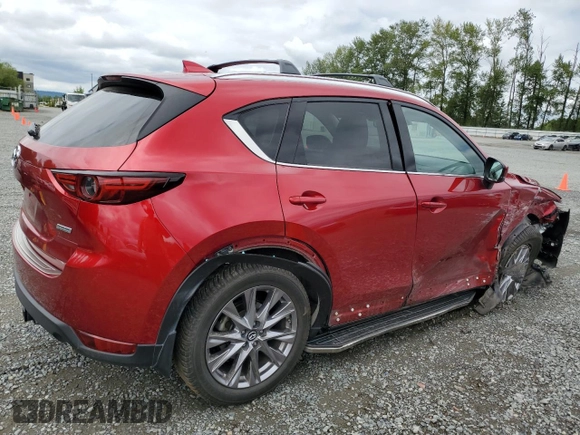 2019 Mazda CX-5 Grand Touring with VIN JM3KFBDM2K0639247, listed as a Copart auction lot 64060045 with 69,563 mi miles and Salvage title. Bid and sale history available at DreamBid. Image 3.