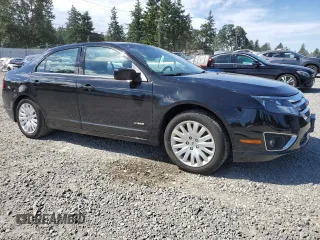 2012 Ford Fusion Hybrid с VIN 3FADP0L38CR181507, выставлен на аукционе Copart как лот 58767785 с пробегом 133 844 миль миль и Списание • Salvage title. История ставок и продаж доступна на DreamBid. Изображение 4.