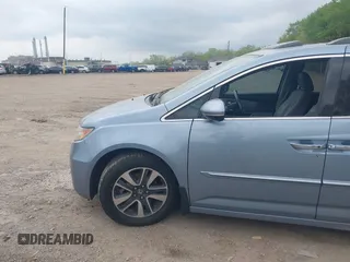 2014 Honda Odyssey Touring with VIN 5FNRL5H91EB081811, listed as a IAAI auction lot 42153920 with 16 mi miles and . Bid and sale history available at DreamBid. Image 14.