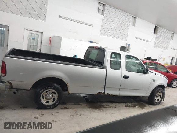 2002 Ford F-150 XL with VIN 1FTRX17W52NB23883, listed as a IAAI auction lot 41721680 with 144,115 mi miles. Bid and sale history available at carsss.com. Image 13.