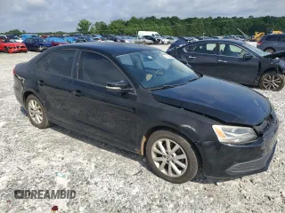 2012 Volkswagen Jetta SE with VIN 3VWDX7AJ3CM114196, listed as a Copart auction lot 61236545 with 128,893 mi miles and Salvage title. Bid and sale history available at DreamBid. Image 4.