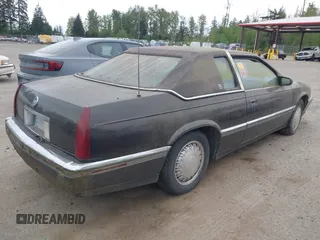1992 Cadillac Eldorado z VIN 1G6EL13B0NU605624, wystawiony jako IAAI lot #42127549 z przebiegiem Nie podano mil oraz . Historia ofert i sprzedaży dostępna na DreamBid. Obrazek 4.