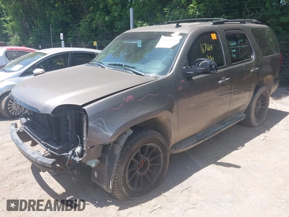 2013 GMC Yukon SLT with VIN 1GKS2CE04DR290293, listed as a IAAI auction lot 39620358 with 167,664 mi miles. Bid and sale history available at carsss.com. Image 2.