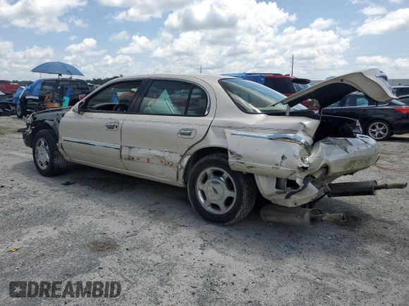 2001 Lincoln Continental z VIN 1LNHM97V91Y622267, wystawiony jako Copart lot #59915445 z przebiegiem 77 070 mil mil oraz Szkoda całkowita • Salvage title. Historia ofert i sprzedaży dostępna na DreamBid. Obrazek 2.