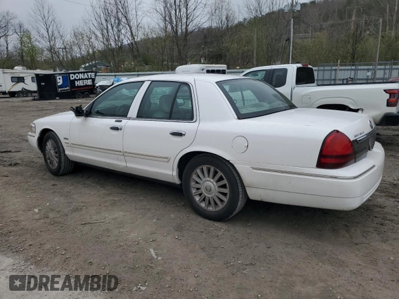 2010 Mercury Grand Marquis LS z VIN 2MEBM7FV2AX606751, wystawiony jako Copart lot #52798295 z przebiegiem 100 616 mil mil oraz Szkody całkowita. Historia ofert i sprzedaży dostępna na DreamBid. Obrazek 2.