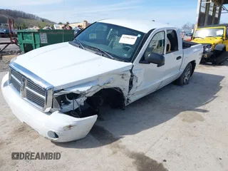 2006 Dodge Dakota SLT z VIN 1D7HW48K06S676241, wystawiony jako IAAI lot #41986300 z przebiegiem 112 215 mil mil oraz . Historia ofert i sprzedaży dostępna na DreamBid. Obrazek 2.