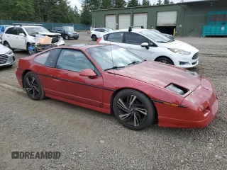 1987 Pontiac Fiero GT z VIN 1G2PG1199HP214795, wystawiony jako Copart lot #75901054 z przebiegiem 206 675 mil mil oraz Szkody całkowita. Historia ofert i sprzedaży dostępna na DreamBid. Obrazek 4.