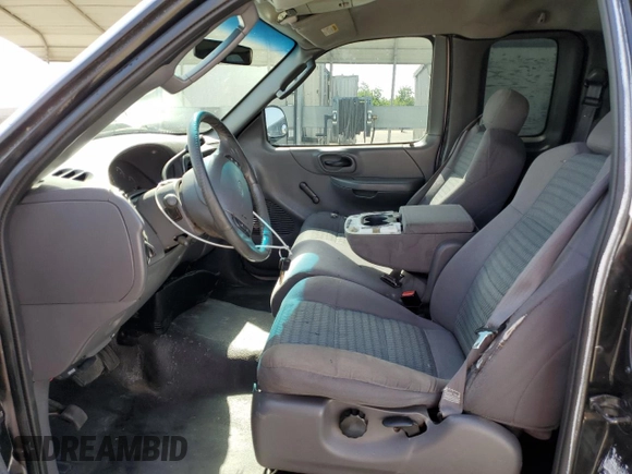 2003 Ford F-150 XL z VIN 2FTRX17253CA75533, wystawiony jako Copart lot #57361145 z przebiegiem 220 482 mil mil oraz Szkoda całkowita • Salvage title. Historia ofert i sprzedaży dostępna na DreamBid. Obrazek 7.