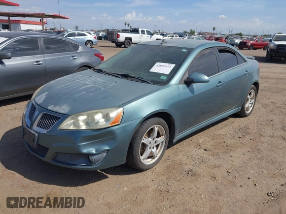 2009 Pontiac G6 1SB with VIN 1G2ZJ57K594261692, listed as a IAAI auction lot 42802373 with 200,469 mi miles and . Bid and sale history available at DreamBid. Image 2.