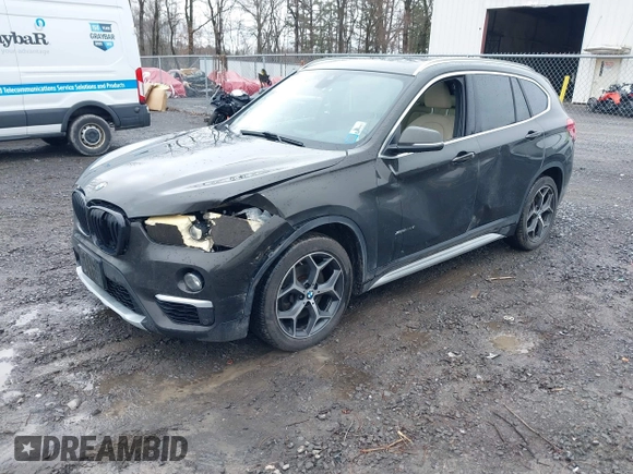 2018 BMW X1 xDrive28i with VIN WBXHT3C34J5K31430, listed as a IAAI auction lot 41954792 with 125,447 mi miles. Bid and sale history available at carsss.com. Image 2.