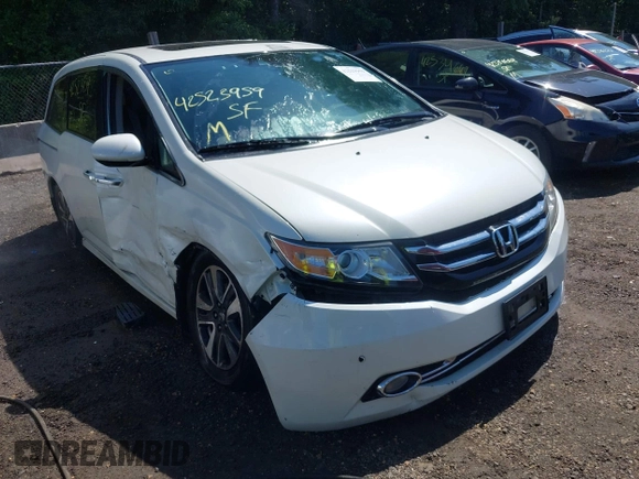 2014 Honda Odyssey Touring with VIN 5FNRL5H94EB071788, listed as a IAAI auction lot 42523959 with 244,734 mi miles and . Bid and sale history available at DreamBid. Image 6.