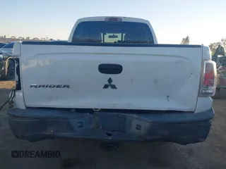 2006 Mitsubishi Raider Duro Cross with VIN 1Z7HC38K36S576409, listed as a IAAI auction lot 41410982 with 152,476 mi miles. Bid and sale history available at carsss.com. Image 16.