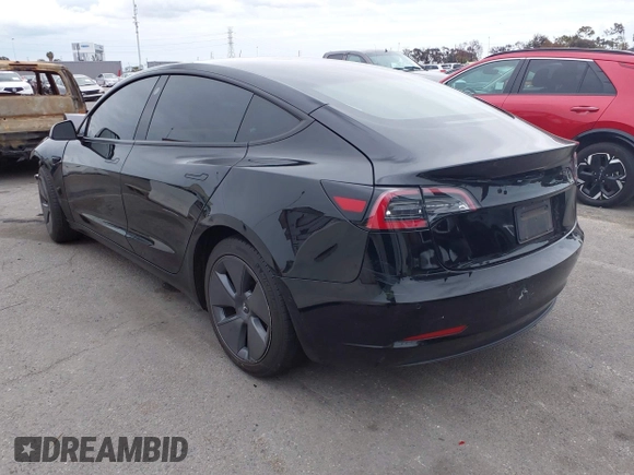 2022 Tesla Model 3 with VIN 5YJ3E1EA7NF314744, listed as a IAAI auction lot 42057596 with 30,936 mi miles and . Bid and sale history available at DreamBid. Image 3.