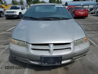 1997 Dodge Stratus z VIN 1B3EJ56H0VN679440, wystawiony jako Copart lot #71977454 z przebiegiem 83 367 mil mil oraz Tytuł czysty. Historia ofert i sprzedaży dostępna na DreamBid. Obrazek 5.