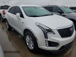 2022 Cadillac XT5 FWD Luxury z VIN 1GYKNAR48NZ163921, wystawiony jako Copart lot #74507874 z przebiegiem 5 723 mil mil oraz Nie do naprawy • Non repairable. Historia ofert i sprzedaży dostępna na DreamBid. Obrazek 4.