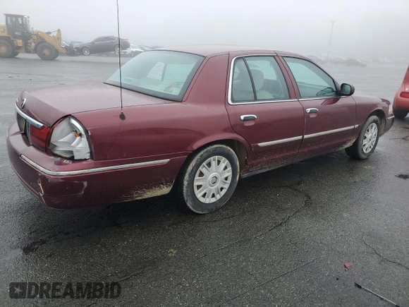 2005 Mercury Grand Marquis GS with VIN 2MEFM74W05X604628, listed as a Copart auction lot 51332335 with 165,224 mi miles and Salvage Title. Bid and sale history available at DreamBid. Image 3.