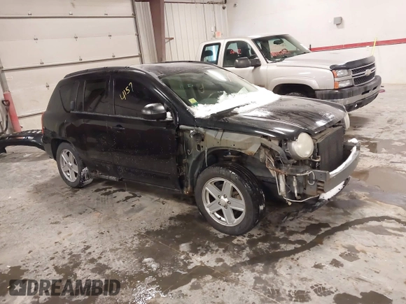 2010 Jeep Compass Sport with VIN 1J4NF4FB0AD501897, listed as a IAAI auction lot 41570009 with 198,376 mi miles. Bid and sale history available at carsss.com. Image 1.