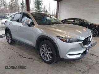 2020 Mazda CX-5 Grand Touring with VIN JM3KFADM0L0738693, listed as a IAAI auction lot 41725906 with 63,629 mi miles. Bid and sale history available at carsss.com. Image 1.