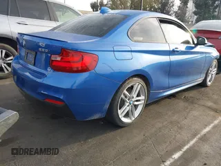 2015 BMW 2 Series 228i with VIN WBA1F5C59FVW98205, listed as a IAAI auction lot 41722804 with 91,879 mi miles. Bid and sale history available at carsss.com. Image 4.