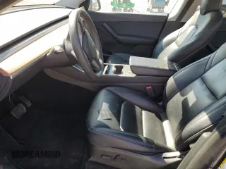 2020 Tesla Model Y Long Range with VIN 5YJYGDEEXLF017789, listed as a Copart auction lot 52705185 with 49,470 mi miles and Salvage Title. Bid and sale history available at DreamBid. Image 7.