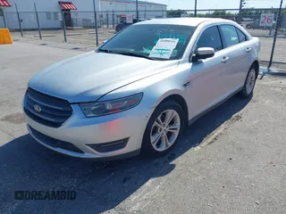 2013 Ford Taurus SEL with VIN 1FAHP2E81DG129229, listed as a IAAI auction lot 41999326 with 205,856 mi miles. Bid and sale history available at carsss.com. Image 2.