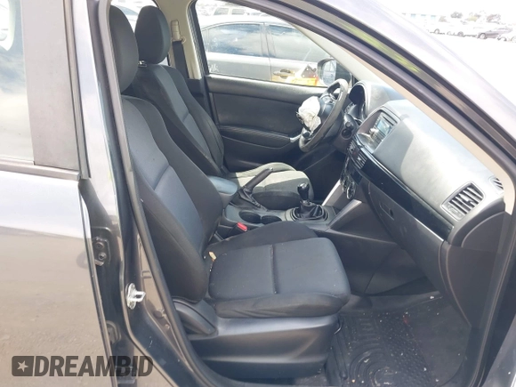 2014 Mazda CX-5 Sport with VIN JM3KE2BE0E0411377, listed as a IAAI auction lot 42143229 with 137,384 mi miles and . Bid and sale history available at carsss.com. Image 5.