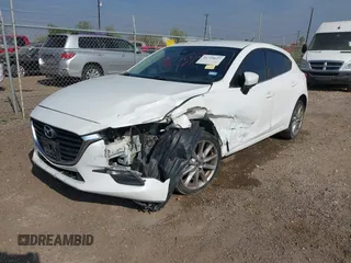 2017 Mazda 3 Touring with VIN 3MZBN1L77HM157118, listed as a IAAI auction lot 41734627 with 132,452 mi miles and . Bid and sale history available at DreamBid. Image 17.