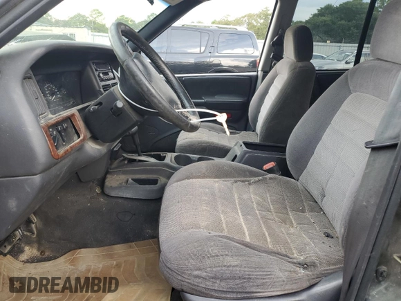 1995 Jeep Grand Cherokee Laredo with VIN 1J4FX58S0SC726476, listed as a Copart auction lot 69608784 with 264,705 mi miles and Salvage Title. Bid and sale history available at carsss.com. Image 7.