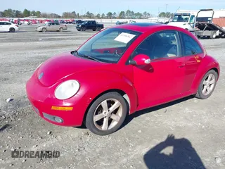 2006 Volkswagen New Beetle Coupe with VIN 3VWSW31C56M403105, listed as a IAAI auction lot 41396362 with 157,213 mi miles. Bid and sale history available at carsss.com. Image 2.