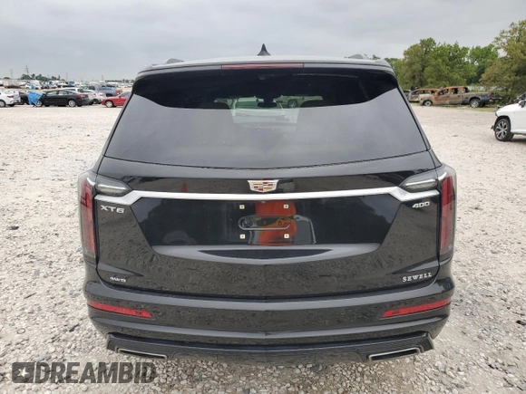 2023 Cadillac XT6 AWD Sport z VIN 1GYKPGRS6PZ126039, wystawiony jako Copart lot #55948605 z przebiegiem 39 966 mil mil oraz Szkoda całkowita • Salvage title. Historia ofert i sprzedaży dostępna na DreamBid. Obrazek 6.