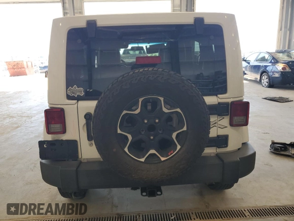 2015 Jeep Wrangler Unlimited Sahara with VIN 1C4BJWEG2FL620001, listed as a Copart auction lot 63914725 with 114,810 mi miles and Salvage title. Bid and sale history available at DreamBid. Image 6.