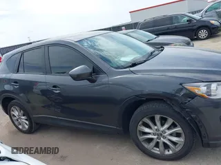 2014 Mazda CX-5 Grand Touring with VIN JM3KE2DY0E0354220, listed as a IAAI auction lot 41885502 with 168,901 mi miles. Bid and sale history available at carsss.com. Image 13.