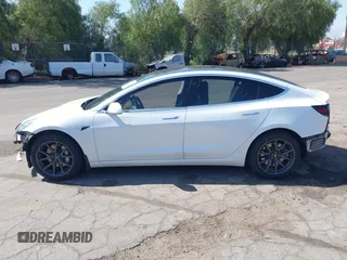 2018 Tesla Model 3 Long Range Battery with VIN 5YJ3E1EAXJF108781, listed as a IAAI auction lot 41962628 with 61,208 mi miles and . Bid and sale history available at DreamBid. Image 15.