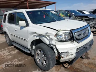 2011 Honda Pilot Touring z VIN 5FNYF3H95BB010114, wystawiony jako IAAI lot #41867154 z przebiegiem 253 727 mil mil oraz . Historia ofert i sprzedaży dostępna na DreamBid. Obrazek 1.