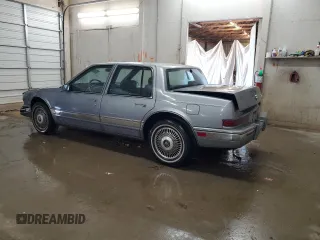 1991 Cadillac Seville z VIN 1G6KS53B2MU809384, wystawiony jako Copart lot #77185134 z przebiegiem 134 769 mil mil oraz Szkody całkowita. Historia ofert i sprzedaży dostępna na DreamBid. Obrazek 2.