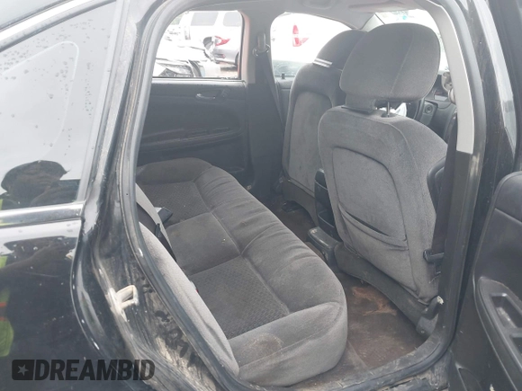 2014 Chevrolet Impala LT with VIN 2G1WB5E39E1104995, listed as a IAAI auction lot 42420840 with 11 mi miles and . Bid and sale history available at DreamBid. Image 8.