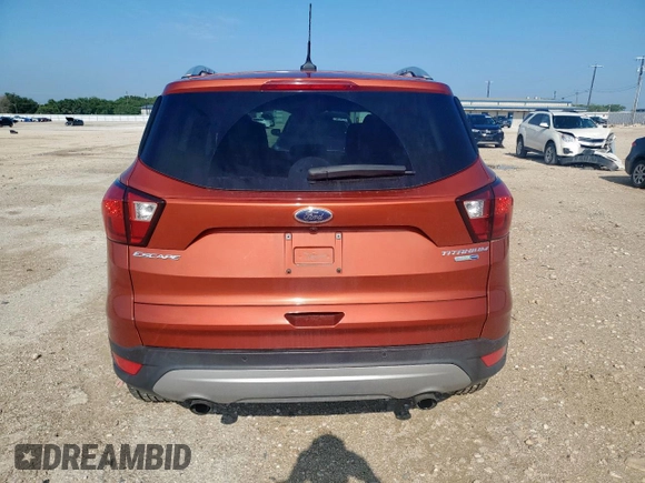 2019 Ford Escape Titanium с VIN 1FMCU9J95KUB54634, выставлен на аукционе Copart как лот 58171885 с пробегом 39 823 миль миль и Списание • Salvage title. История ставок и продаж доступна на DreamBid. Изображение 6.