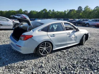 2023 Honda Civic Touring z VIN 2HGFE1F97PH305882, wystawiony jako Copart lot #54826915 z przebiegiem Nie podano mil oraz Szkody całkowita. Historia ofert i sprzedaży dostępna na DreamBid. Obrazek 3.