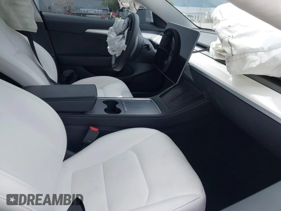 2023 Tesla Model 3 z VIN 5YJ3E1EA5PF383595, wystawiony jako IAAI lot #41965562 z przebiegiem 35 878 mil mil oraz . Historia ofert i sprzedaży dostępna na DreamBid. Obrazek 5.