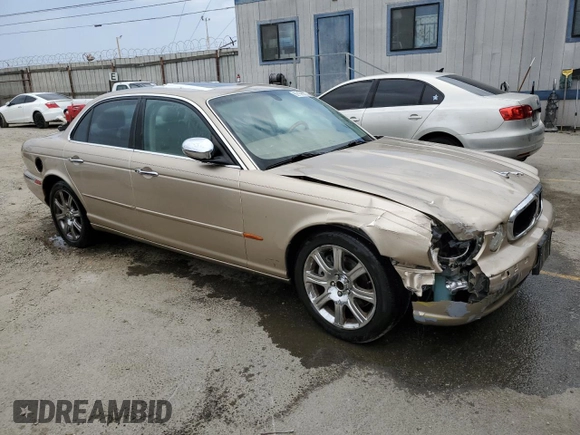 2004 Jaguar XJ with VIN SAJEA74C84SG03857, listed as a Copart auction lot 62156875 with 92,649 mi miles and Salvage title. Bid and sale history available at DreamBid. Image 4.