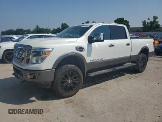 2017 Nissan Titan Platinum Reserve z VIN 1N6BA1F49HN507755, wystawiony jako Copart lot #60161065 z przebiegiem 132 710 mil mil oraz Czysty tytuł • Clean title. Historia ofert i sprzedaży dostępna na DreamBid. Obrazek 1.