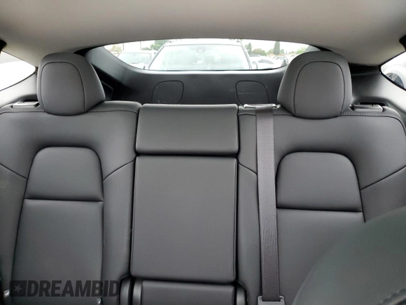 2025 Tesla Model Y Long Range with VIN 7SAYGDED4SF242721, listed as a Copart auction lot 56159955 with 7,131 mi miles and Salvage Title. Bid and sale history available at DreamBid. Image 10.