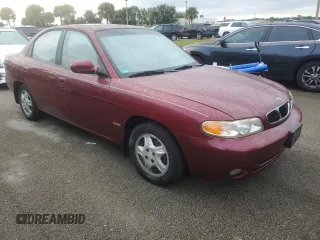 1999 Daewoo Nubira CDX z VIN KLAJB52Z5XK256700, wystawiony jako Copart lot #75085934 z przebiegiem Nie podano mil oraz Szkody całkowita. Historia ofert i sprzedaży dostępna na DreamBid. Obrazek 4.